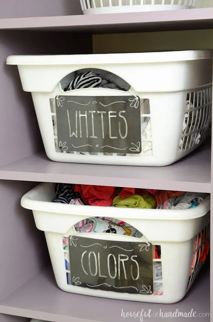 Farmhouse laundry room with black labels on white laundry baskets. Housefulofhandmade.com
