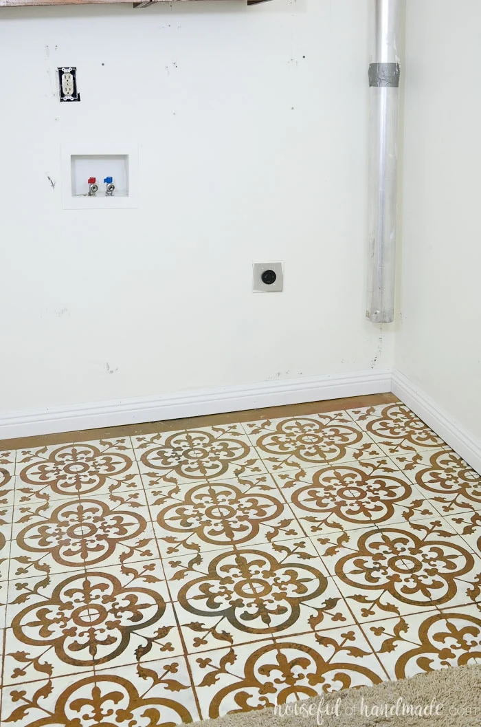It's so easy and inexpensive to transform a floor with a floor stencil. See how we turned out laundry room floor into a masterpiece for only $19. Housefulofhandmade.com