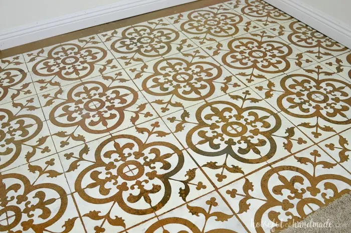 Learn how to paint a floor stencil to create a beautiful patterned tile look on a budget. Housefulofhandmade.com