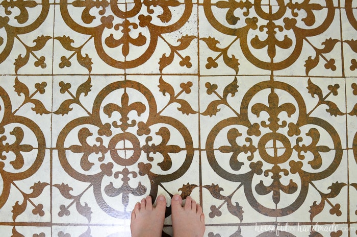 This floor is amazing! I love the patterned tile and cannot believe it was all done with a floor stencil for only a few dollars. Housefulofhandmade.com