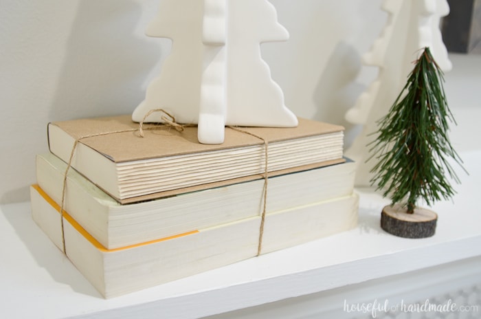 Use some books turned backward to add height to elements on your mantel. Housefulofhandmade.com