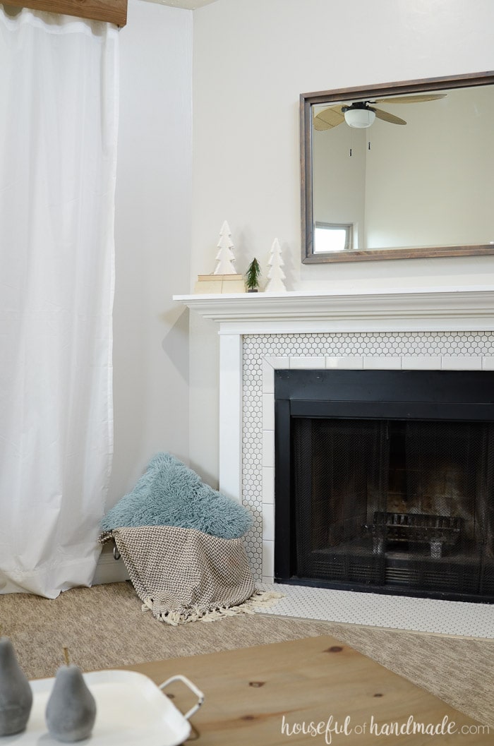 Decorating your mantel for winter can be hard after putting away all the Christmas decor. Keep it simple with a neutral farmhouse mantel and lots of clean space. See how we transitioned to winter with this simple winter mantel. Housefulofhandmade.com