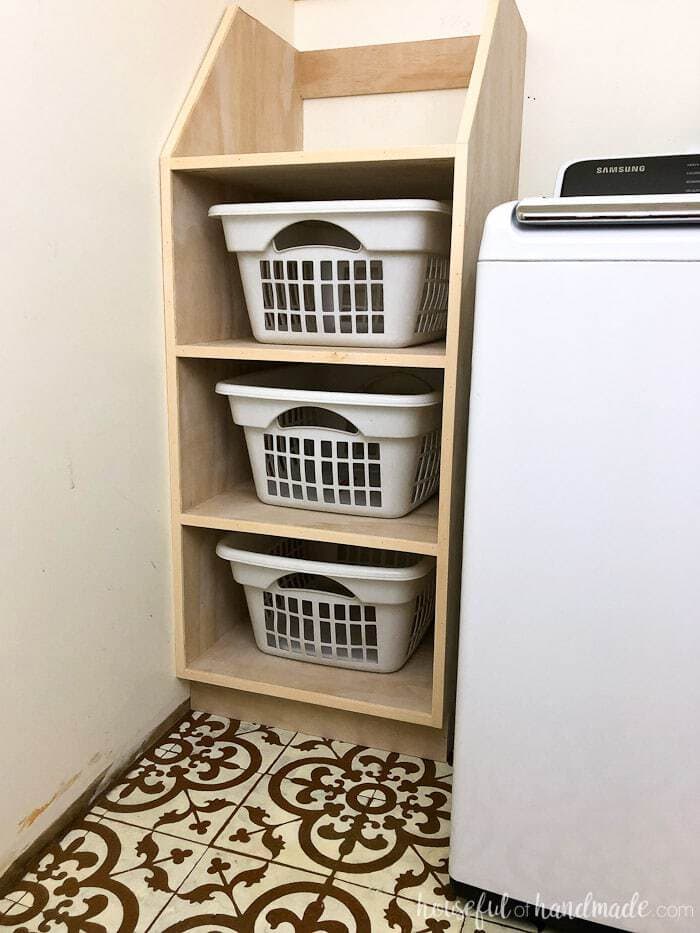 Stackable laundry basket storage with three shelves. 