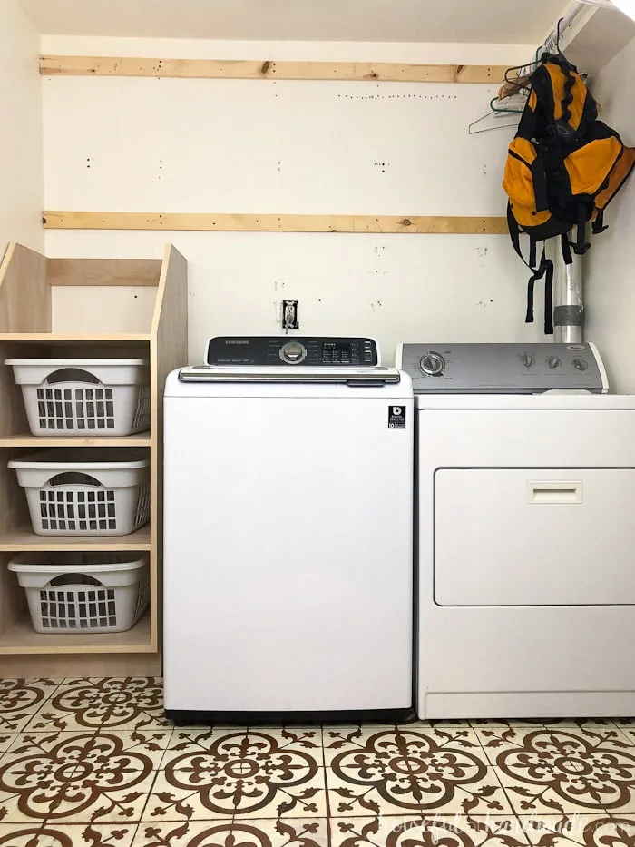 Laundry room with stackable laundry basket storage. 