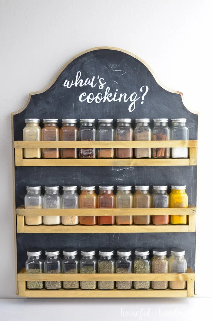 Farmhouse spice rack with chalkboard paint hanging on wall