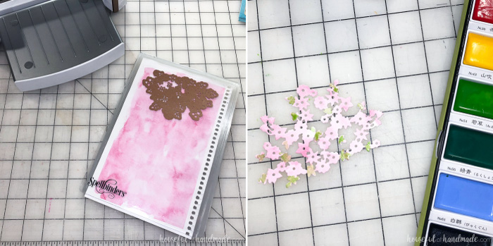 Watercolored paper being cut out with the Spring Canopy Spellbinders die for the large glass candle holder decor. Housefulofhandmade.com