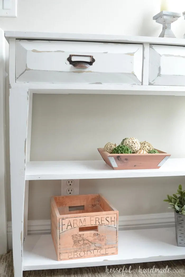 The tampered legs and open shelves give this small console table lots of farmhouse style. Housefulofhandmade.com