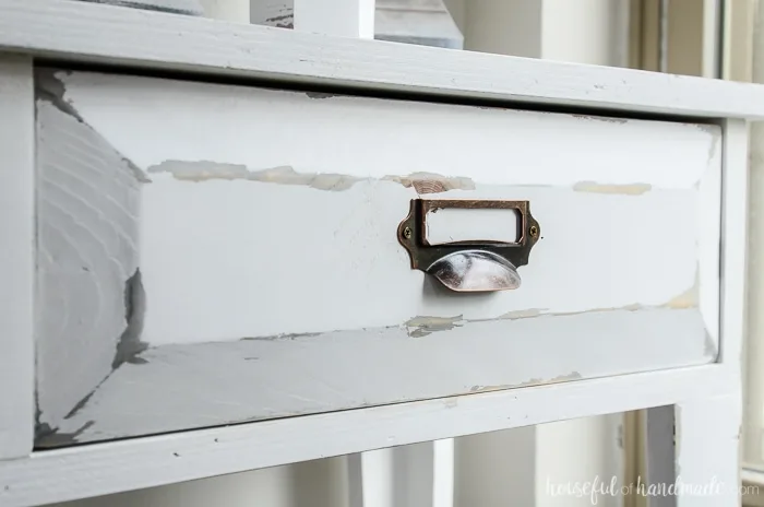 Closeup of the distressing on the farmhouse console table drawer fronts. Housefulofhandmade.com