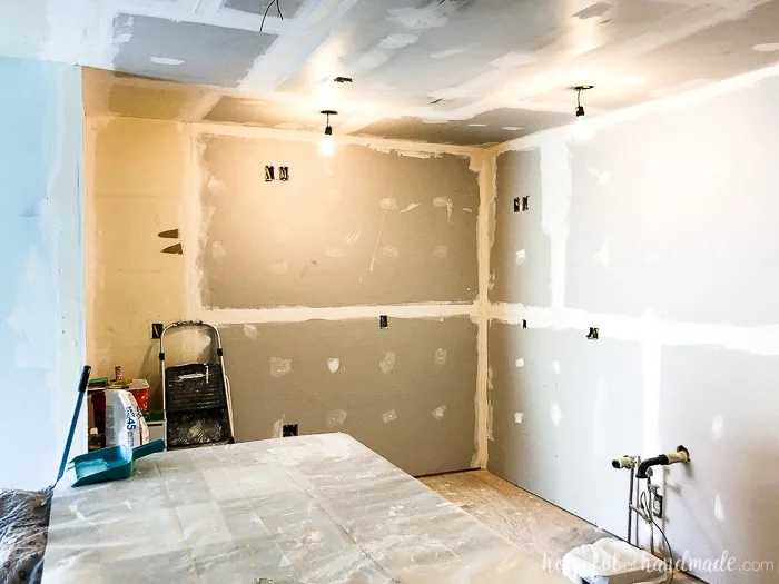 The walls and ceiling are covered in drywall now! We are on track for our 6 week DIY kitchen remodel. Follow along at Housefulofhandmade.com.