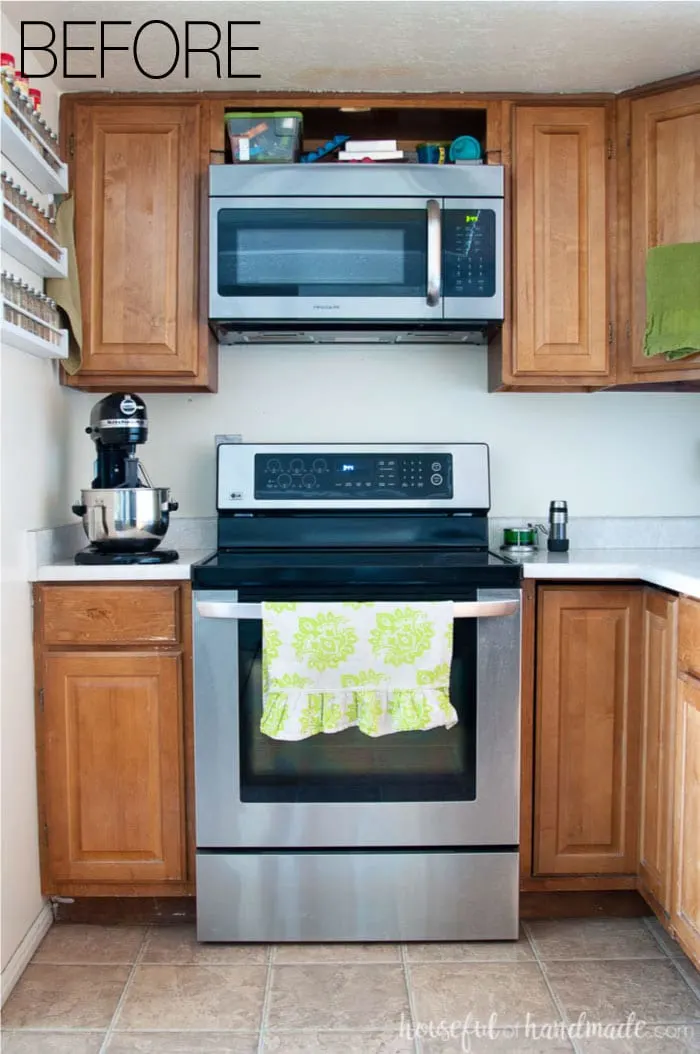 Stainless steel stove and above stove microwave are staying in this budget farmhouse kitchen remodel. See the rest of the plan at Housefulofhandmade.com.