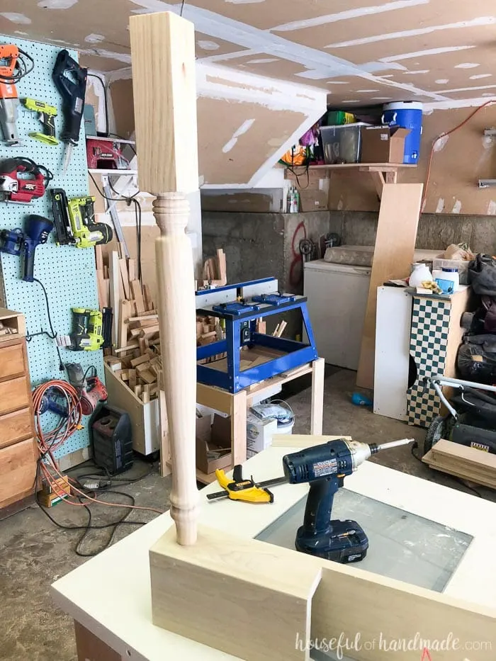 Table leg used to create a farmhouse kitchen island shown with drill.
