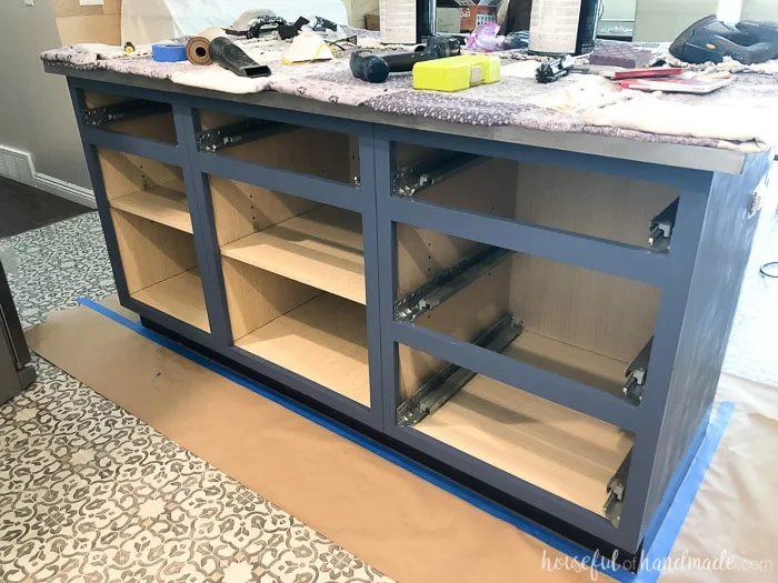 The kitchen island makeover shown with a couple coats of Behr Durango Blue paint. 