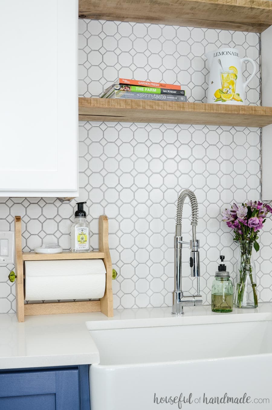 diy farmhouse paper towel holder shown in kitchen next to sink