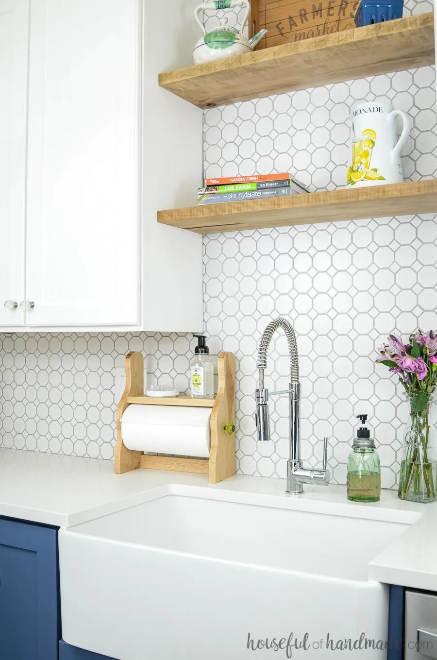 White kitchen with open shelves and white octagon tile backsplash shown with diy farmhouse paper towel holder