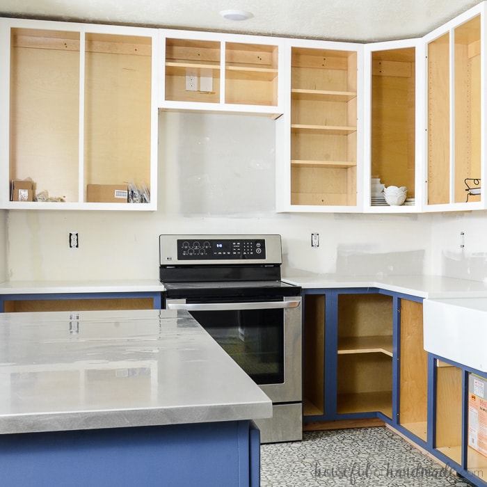 Kitchen with DIY cabinets installed without cabinet doors.