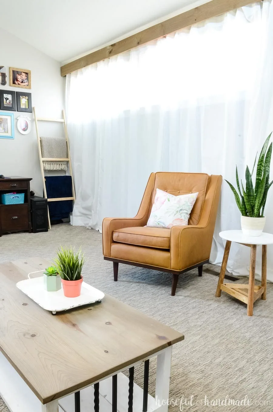 Doing a living room refresh does not mean getting all new furniture. We added a new leather armchair, coordinating end table and more to make our house new again. See our easy steps for refreshing your home for spring at Housefulofhandmade.com.