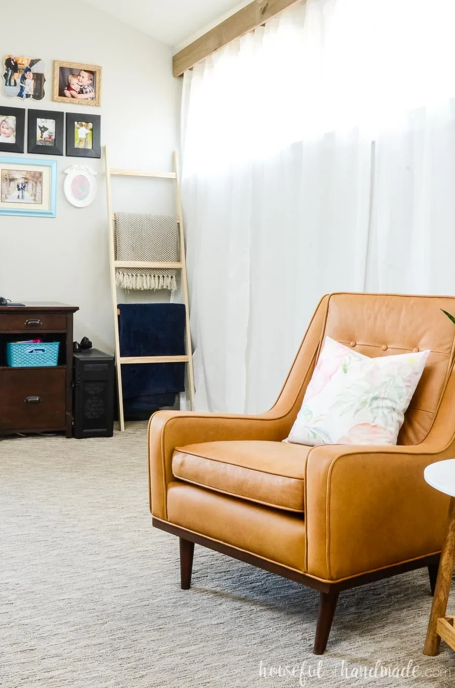 Tan armchair from Article.com in the living room with gallery wall and blanket ladder in the background. See how to easy it is to do a living room refresh for spring. Housefulofhandmade.com