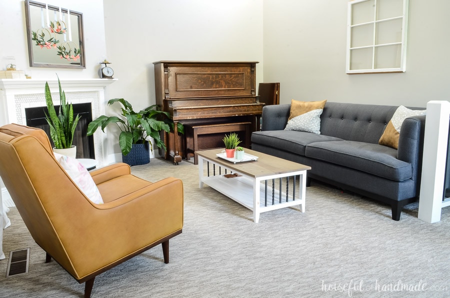 Add fresh plants to the living room to give it a whole new look. Beautiful modern farmhouse living room with leather armchair, navy sofa, rustic coffee table and vintage piano. Housefulofhandmade.com