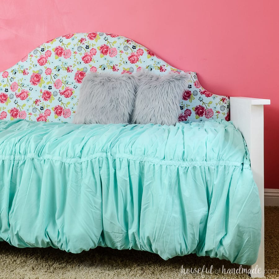 Build an upholstered day bed with these free build plans. This beautiful fabric covered headboard is the perfect focal point for your bedroom. Housefulofhandmade.com