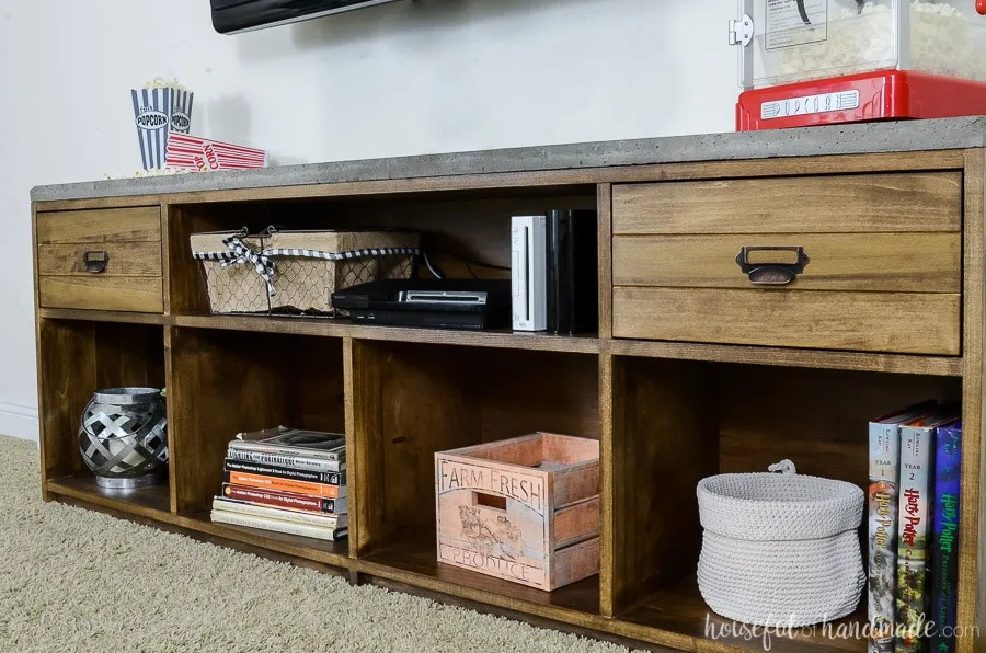 Large 6 foot long TV stand with open shelves and drawers. Rustic TV stand is topped with an industrial concrete top. 