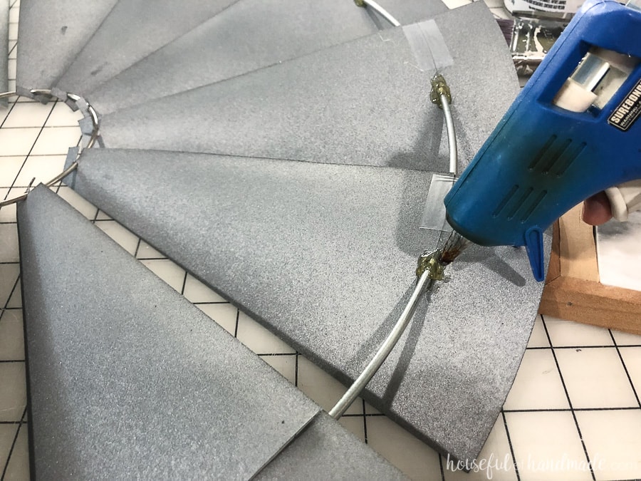 Glue the blades of the decorative windmill onto the metal ring.