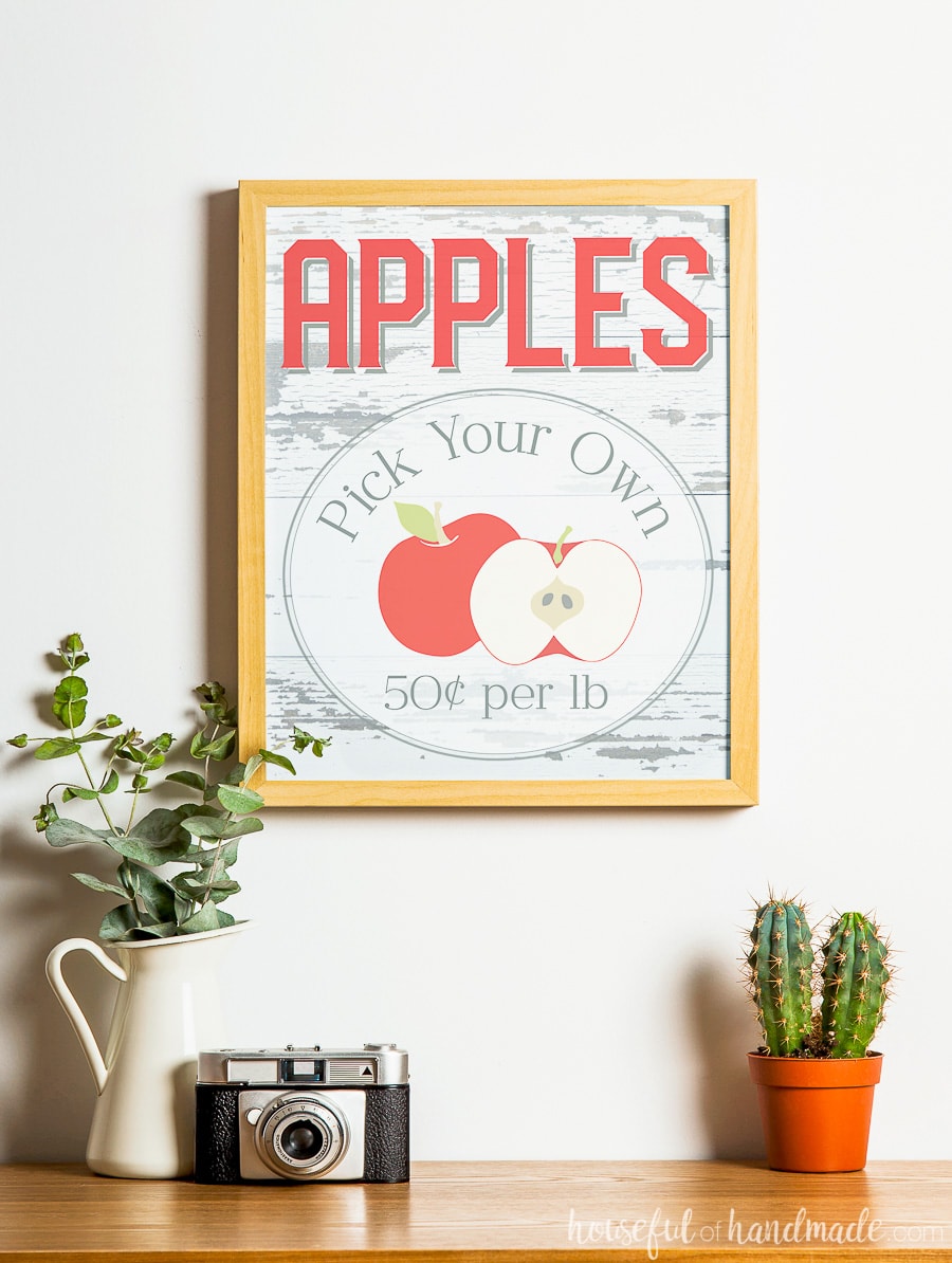 Rustic fall printable: Apples Pick Your Own sign. In a frame above fall decor. 