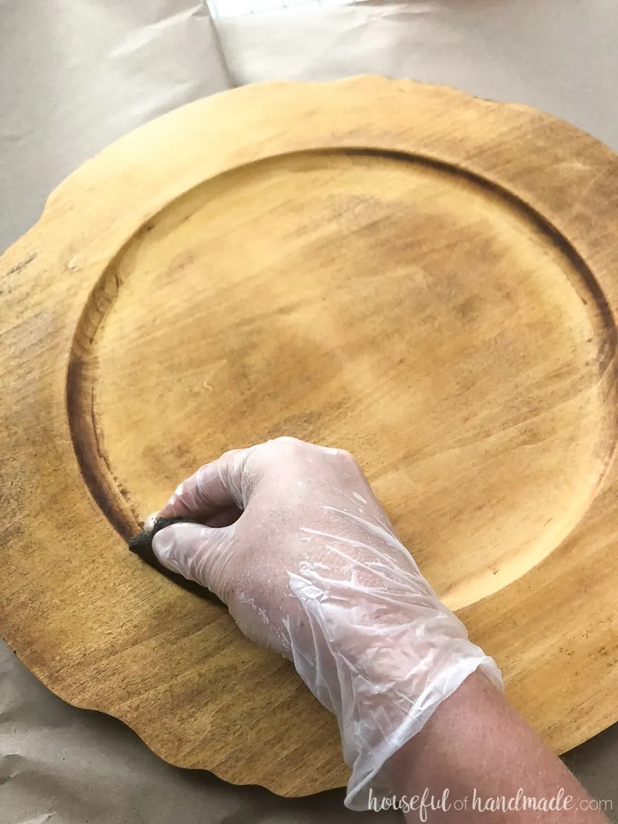 For the upcycled wood tray, use steel wool to scrape off the finish with the paint stripper in the hard to reach places. 
