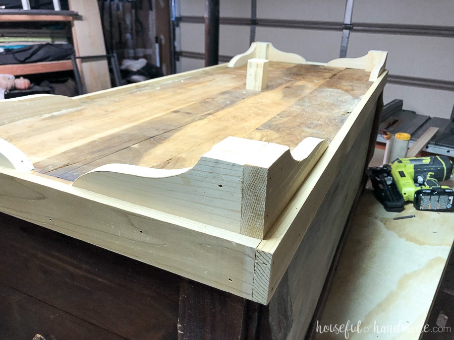 A fifth leg was added to the center of the bottom to support the weight of the refinished storage chest.