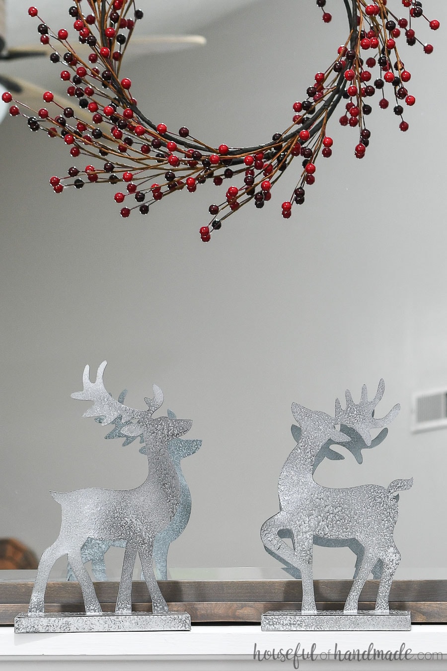 Christmas reindeer figurines made from paper and painted to look like metal.