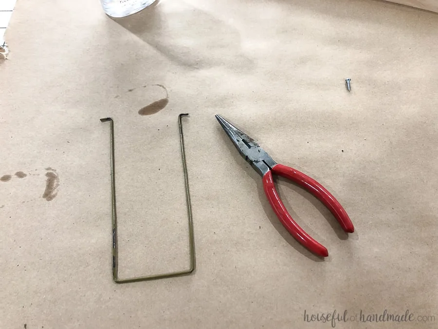 Step 6: create a wire kick-stand out of a wire hanger. 