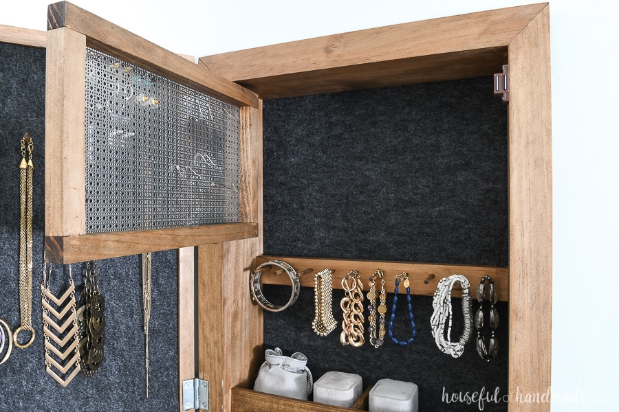The back view of the hinged earring rack in the DIY wall jewelry organizer. 
