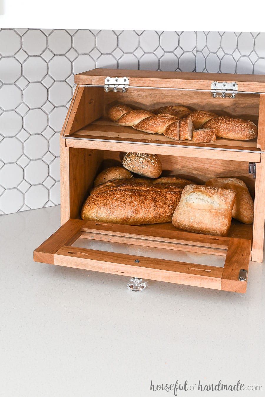 Lower door of the DIY bread box open to show how much room there is inside.