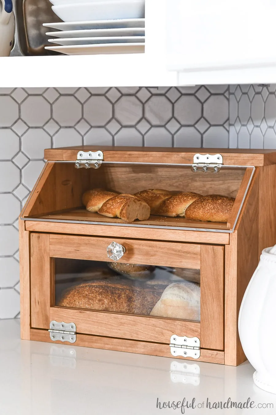 DIY bread box made of cherry wood with pull out cutting board shelf. 