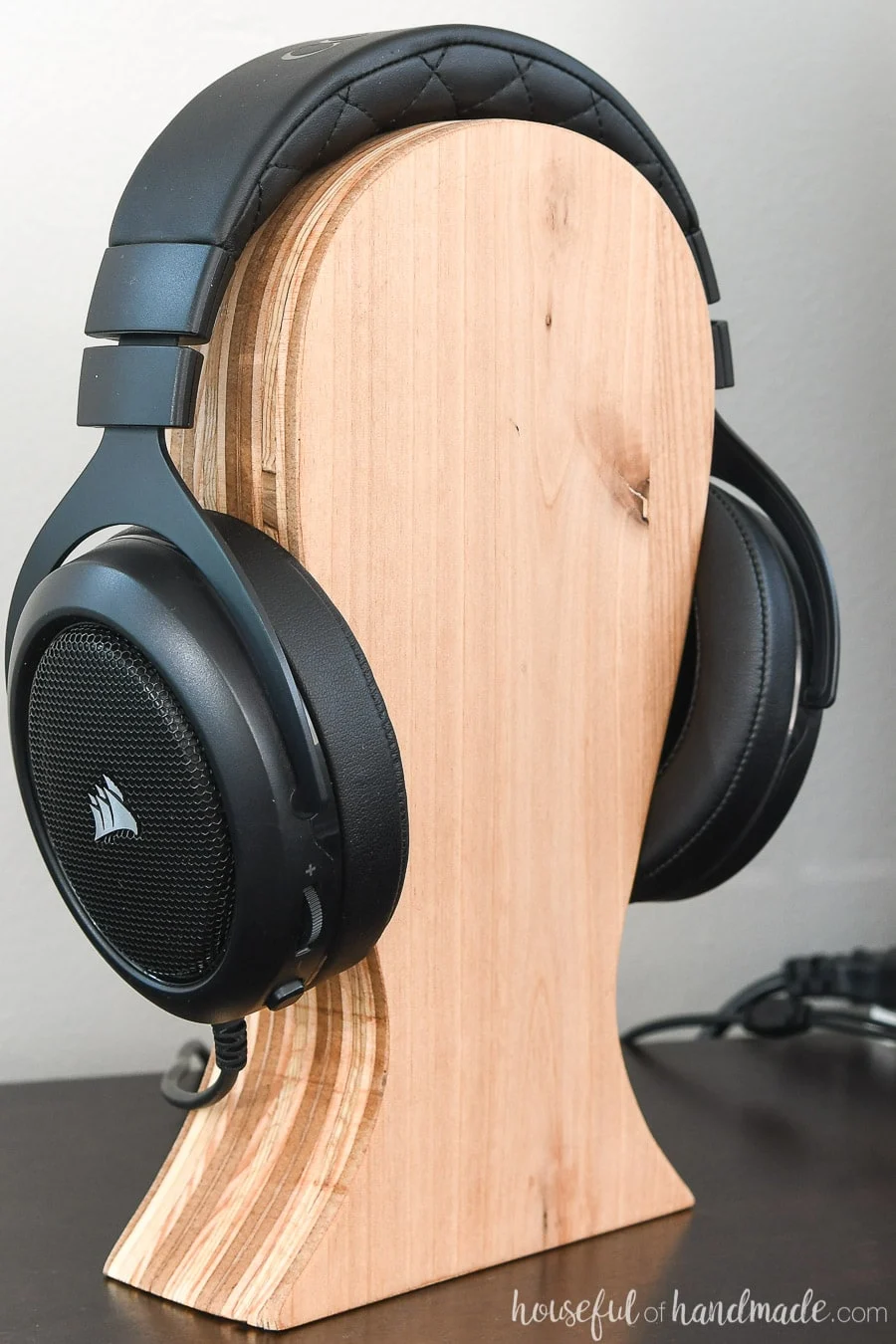 Close-up of the plywood striping on the side of the wood headphone stand. 