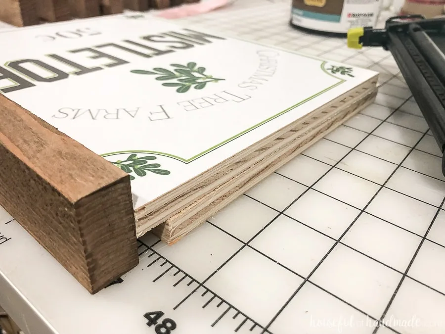 Attaching the side frames of the Easy DIY wood signs. 