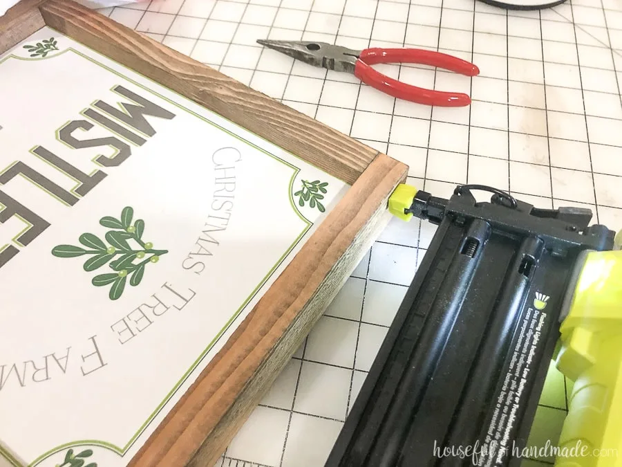 Attaching the rest of the frame pieces for the Easy DIY wood signs. 