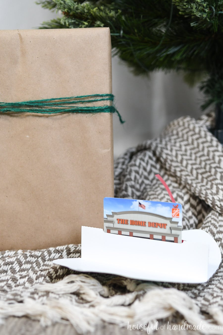 Printable Christmas gift card holder opened up to reveal the pop-up gift card inside. 