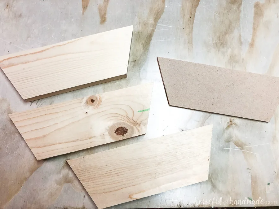 A picture of all the pieces cut for the wooden phone speaker. 