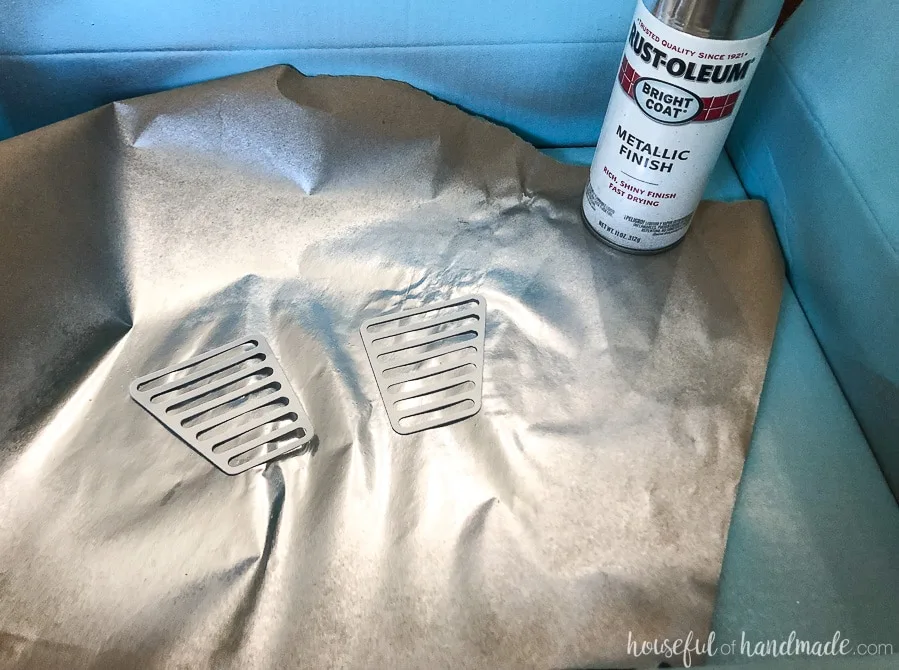 Spray painting metal grates for the retro wooden speaker to look like metal.