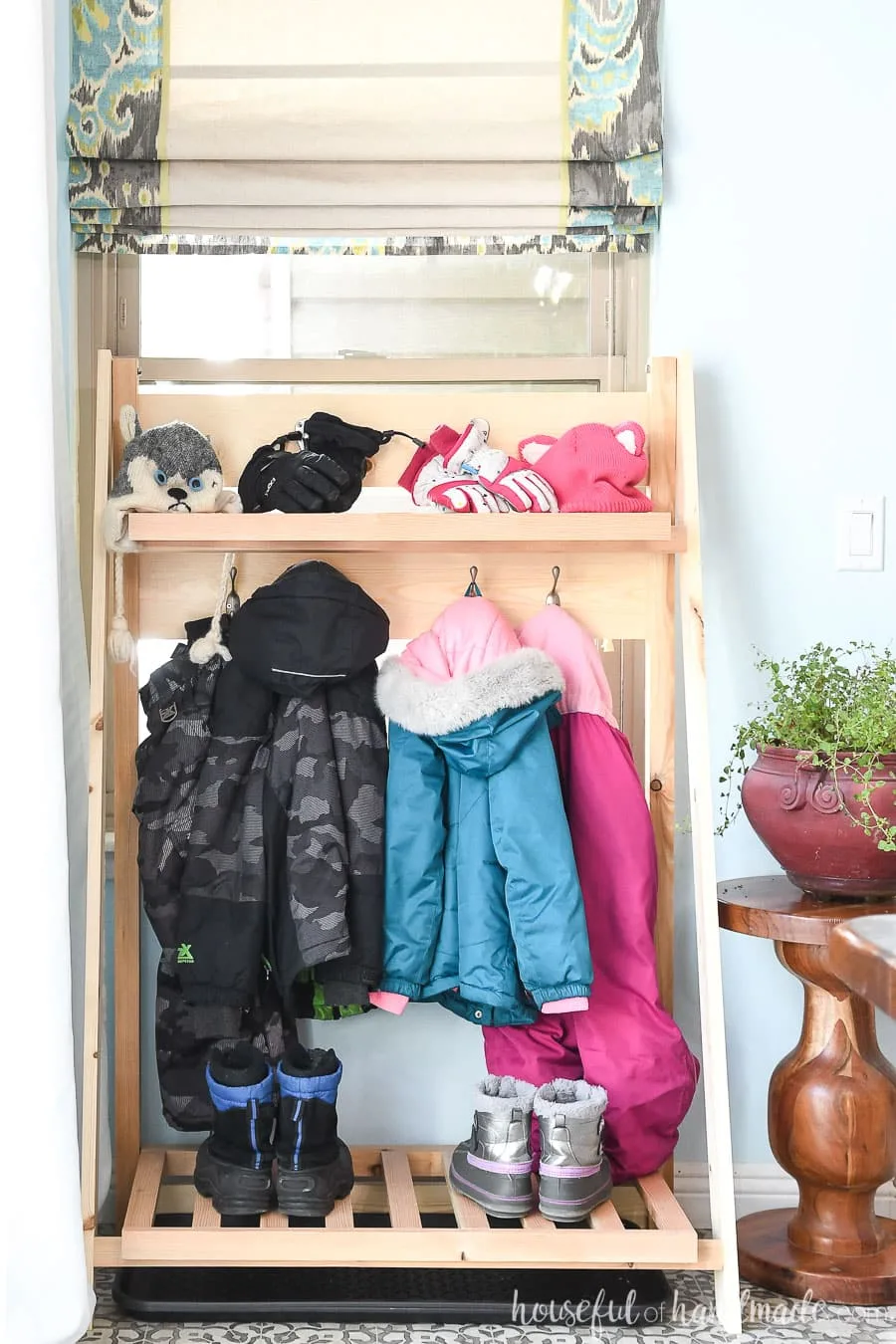 Front view of the collapsible storage shelves for the mudroom. 