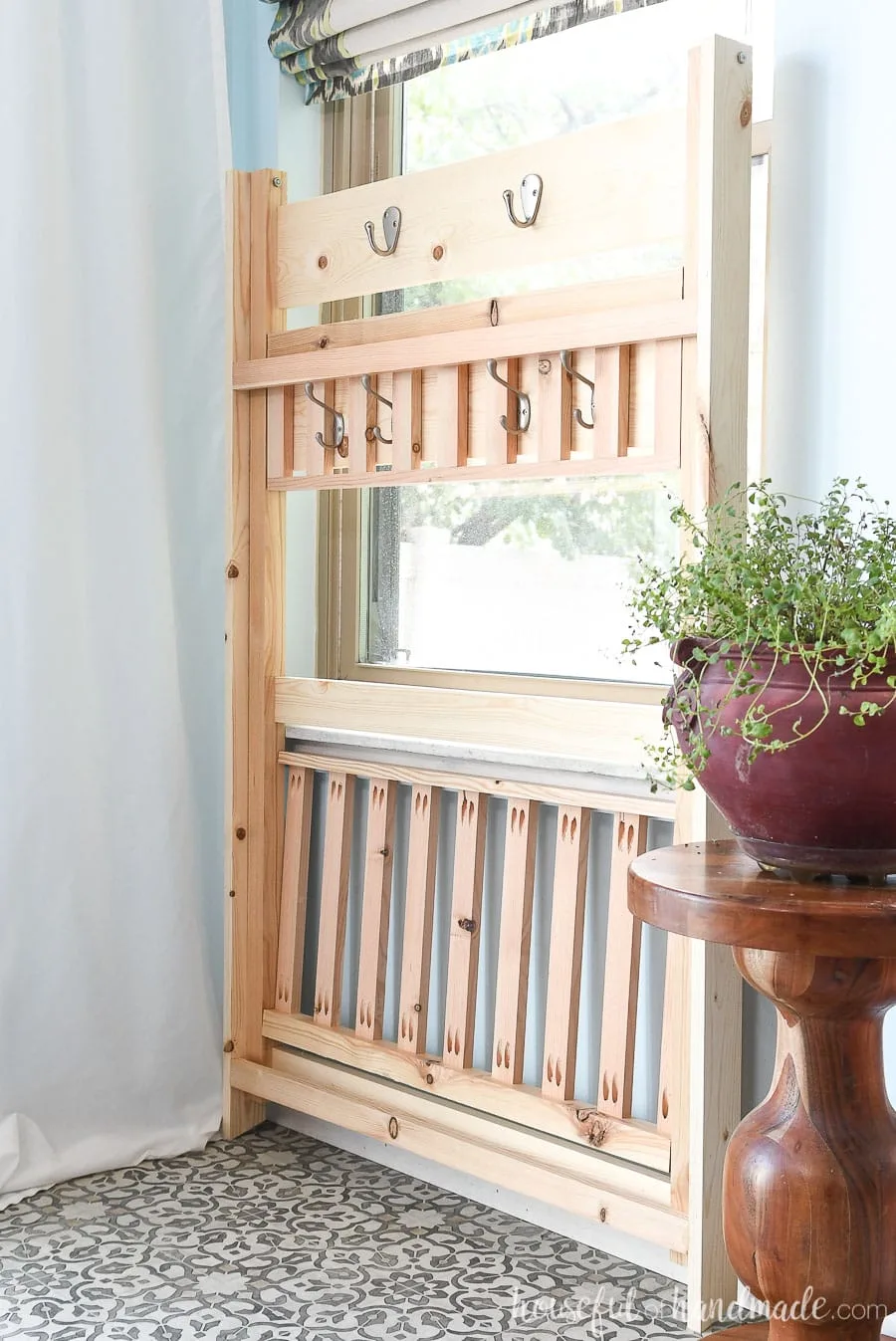 The collapsible mudroom storage shelves folded up flat for storage.