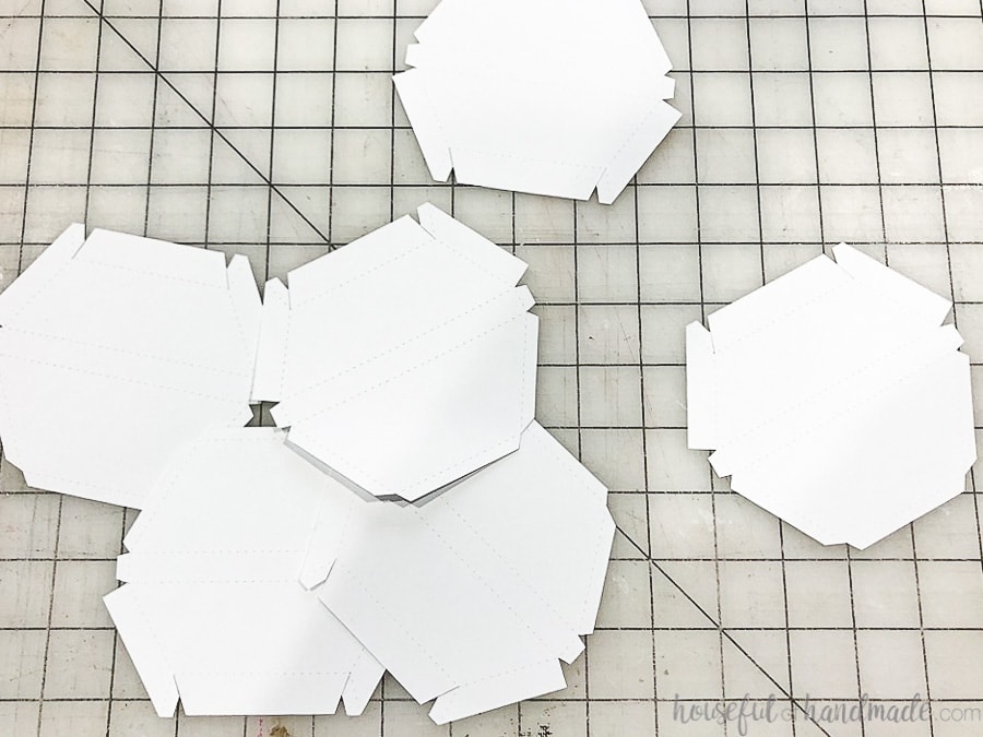 All 6 of the hexagon wall mirror frame pieces cut out of paper. 