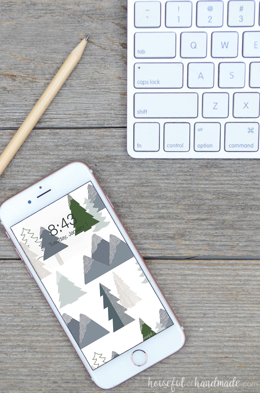 Smartphone on the table with a snowy mountain digital background on it.