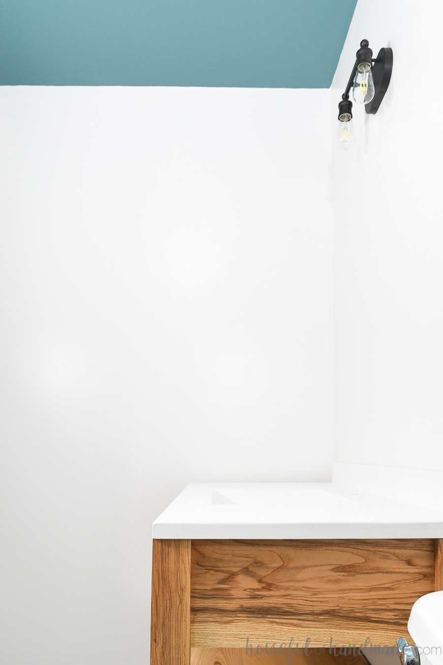 Guest bathroom with wood vanity and bold painted ceiling.