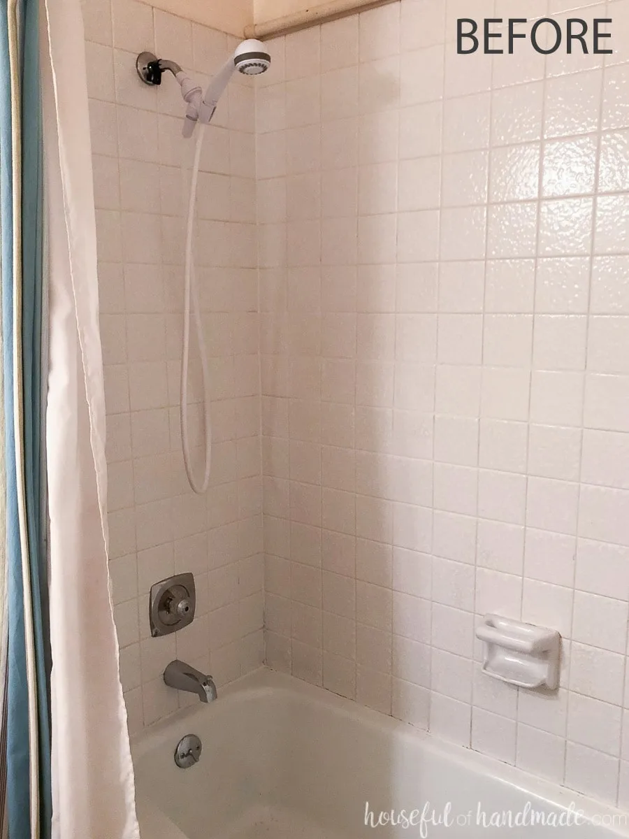 Before view of the shower in the guest bathroom before the rustic modern remodel.