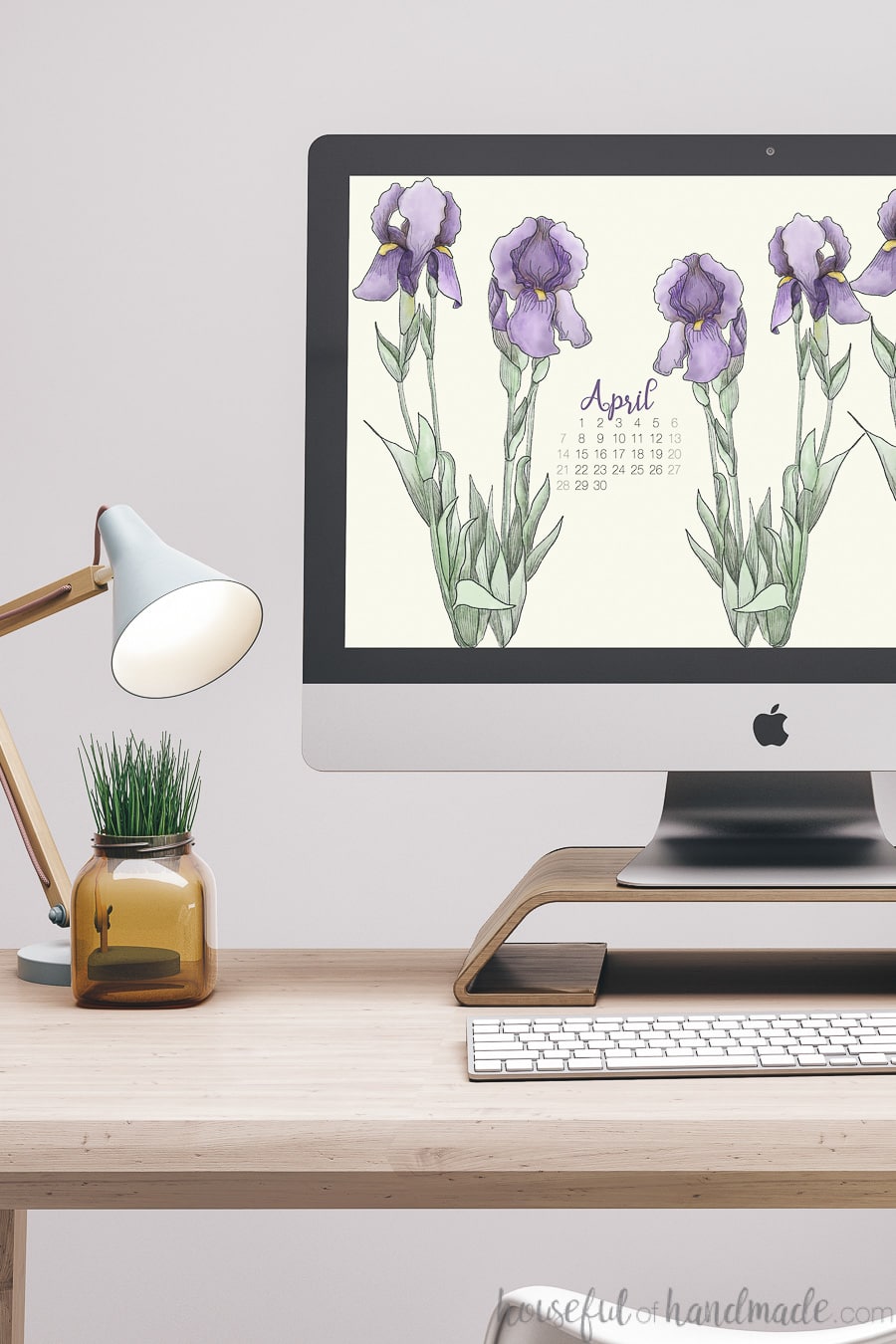 iMac computer with hand-drawn iris digital wallpaper on the screen.
