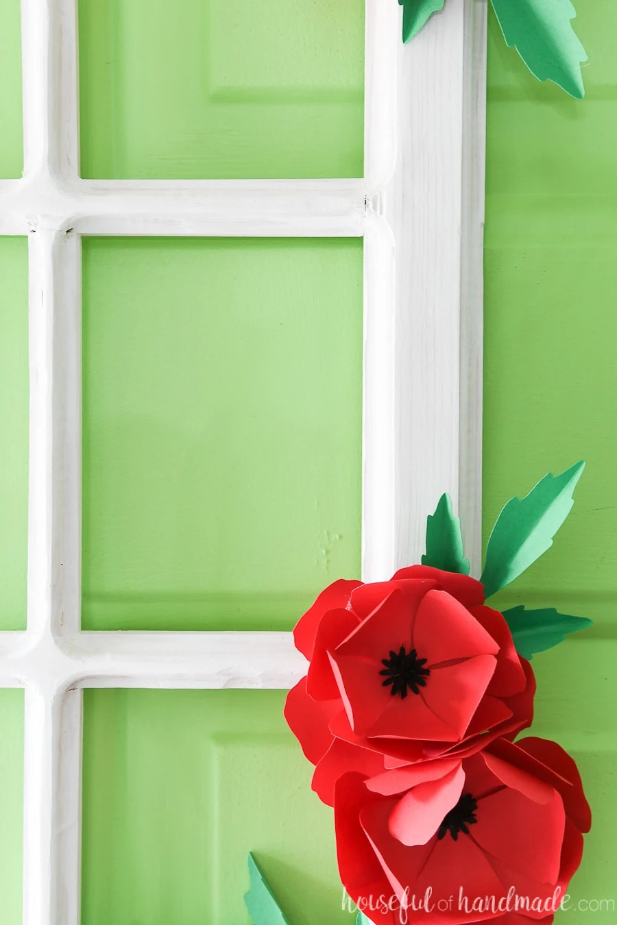 Close up view of the routed edges of the window frame wreath and the paper flowers. 