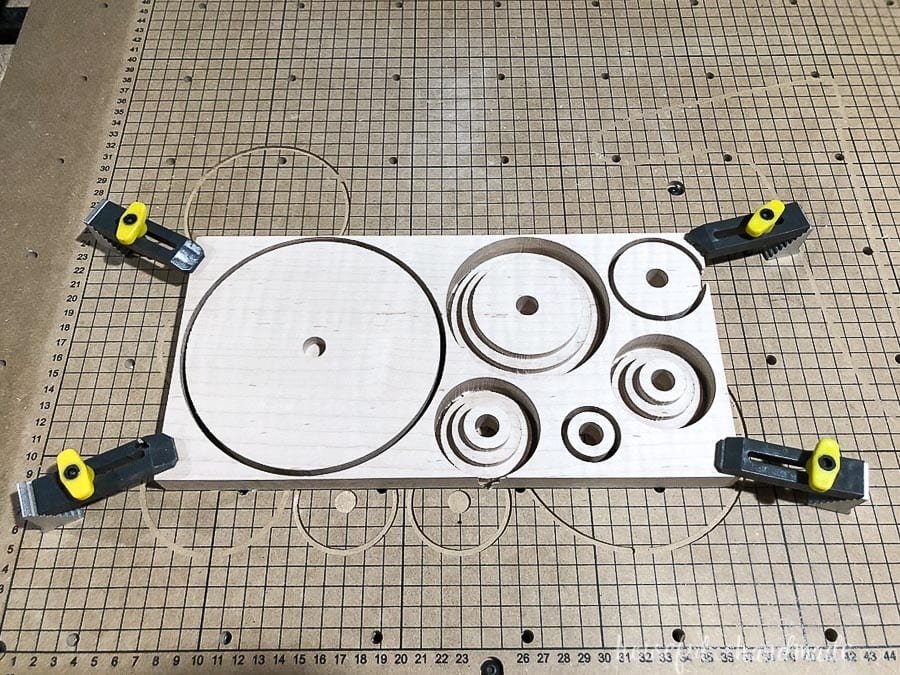 Tiger Maple cut into circles to make up the wood cake stand with a CNC machine.