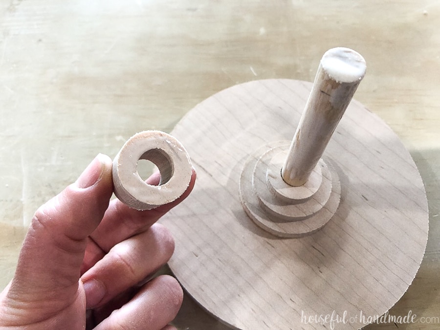 Glueing the small DIY cake plate together with wood glue.