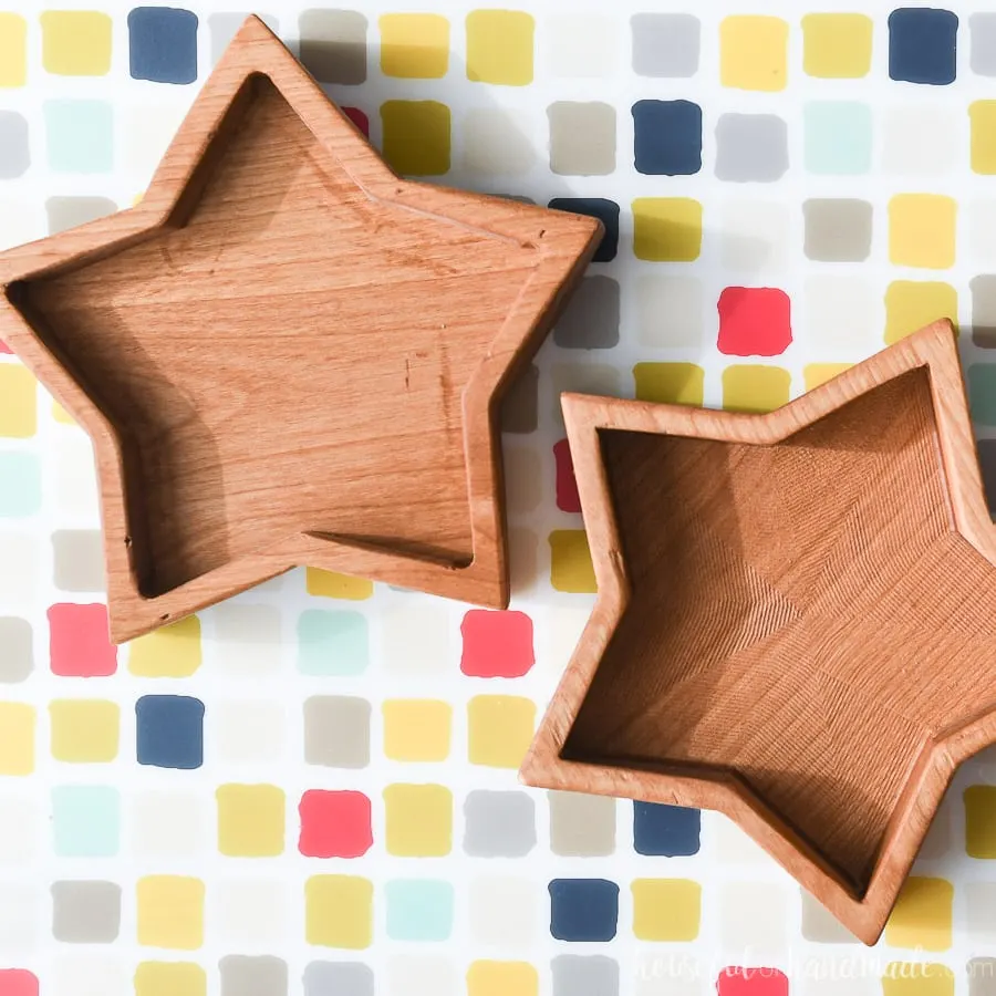 Wooden star bowls made out of alder on a checkered backgrounds